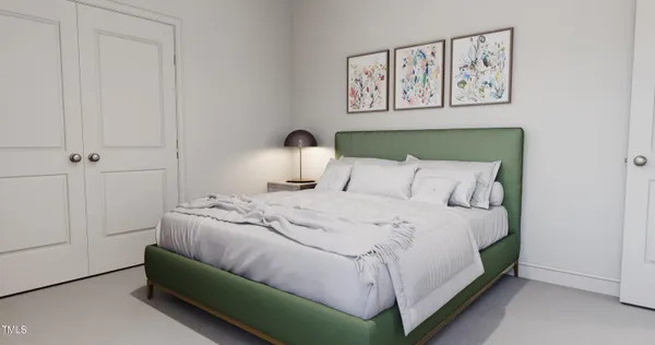 a bedroom with a bed and painting on the wall
