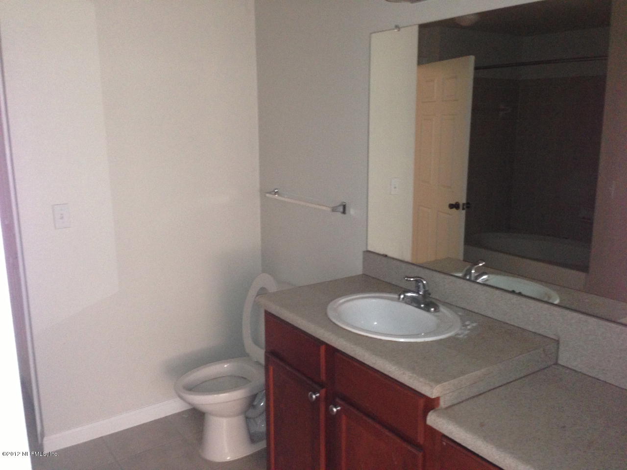 8550 Touchton Road, Unit 717 Jacksonville, FL 32216 - Photo 11 of 15 a bathroom with a sink and a toilet