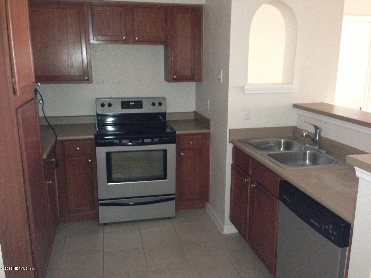 8550 Touchton Road, Unit 717 Jacksonville, FL 32216 - Photo 8 of 15 a kitchen with a stove and a sink
