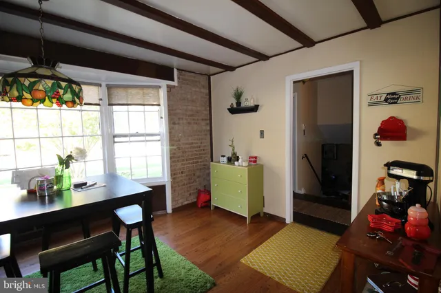 a workspace with furniture and a window