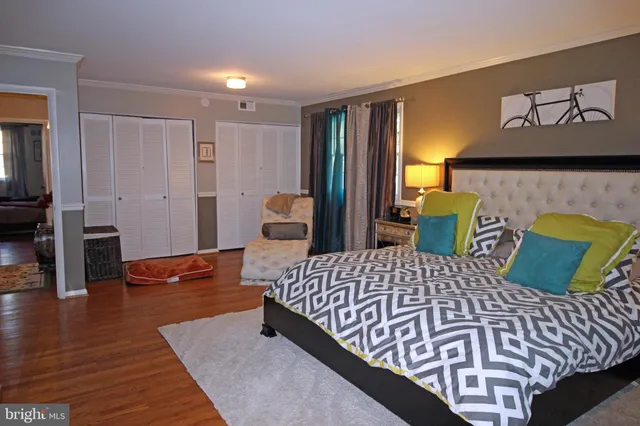 a bedroom with a bed and dresser