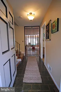 a view of a hallway with windows