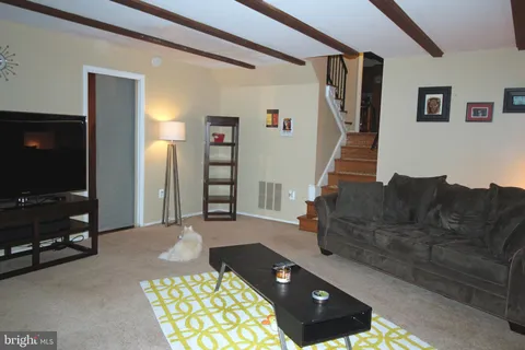 a living room with a couch and a flat screen tv