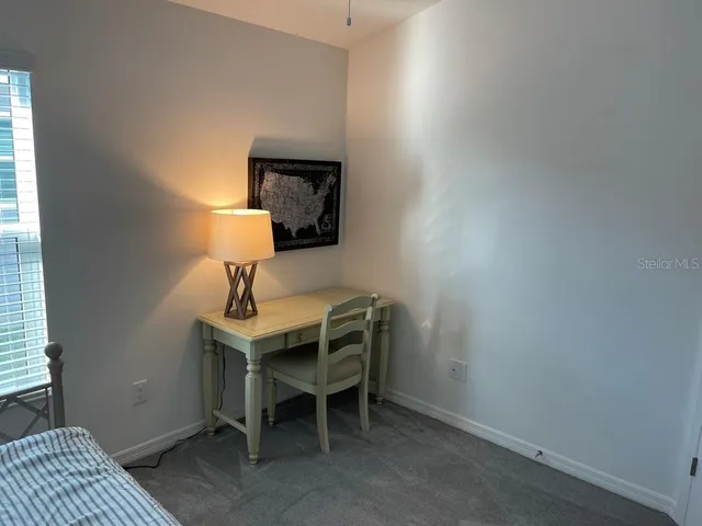 a view of a workspace with furniture