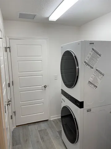 a close view of a utility room with washer and dryer