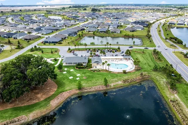 an aerial view of a house with outdoor space swimming pool and outdoor seating