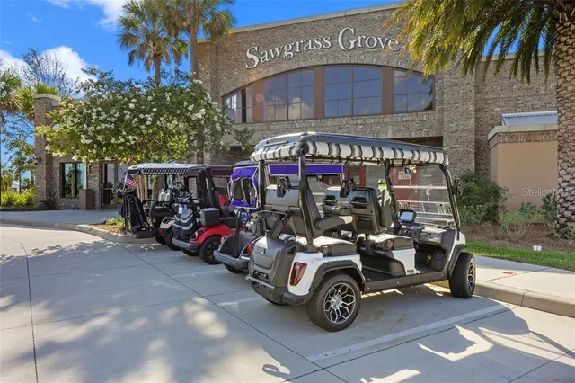 a large kitchen with a table and chairs in it