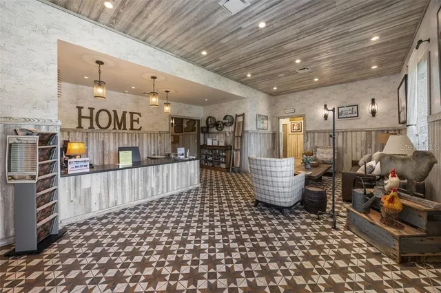 a room with lots of furniture and a chandelier