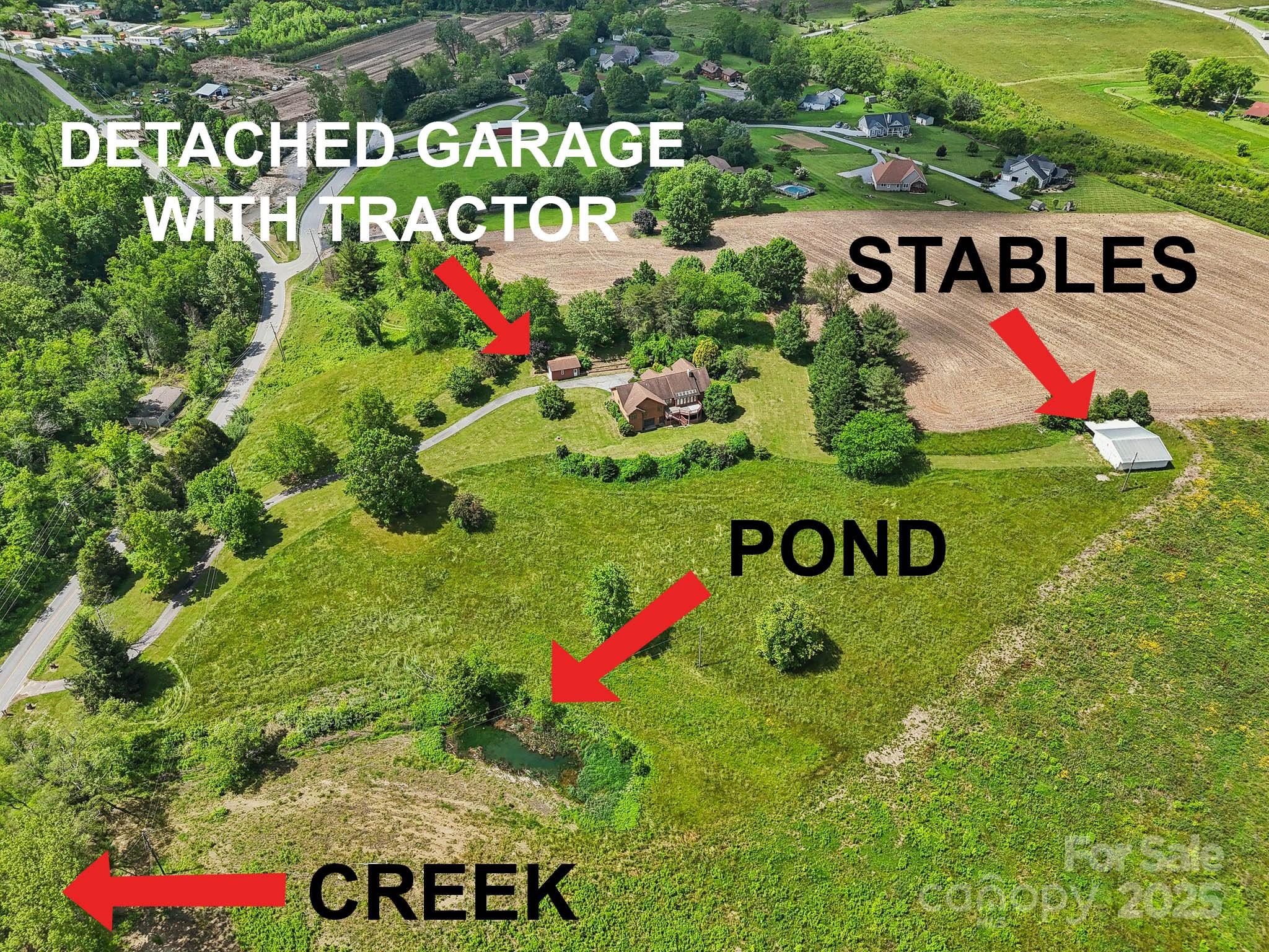 2281 Bearwallow Road Hendersonville, NC 28792 - Photo 1 of 46 a sign that is sitting in front of flowers