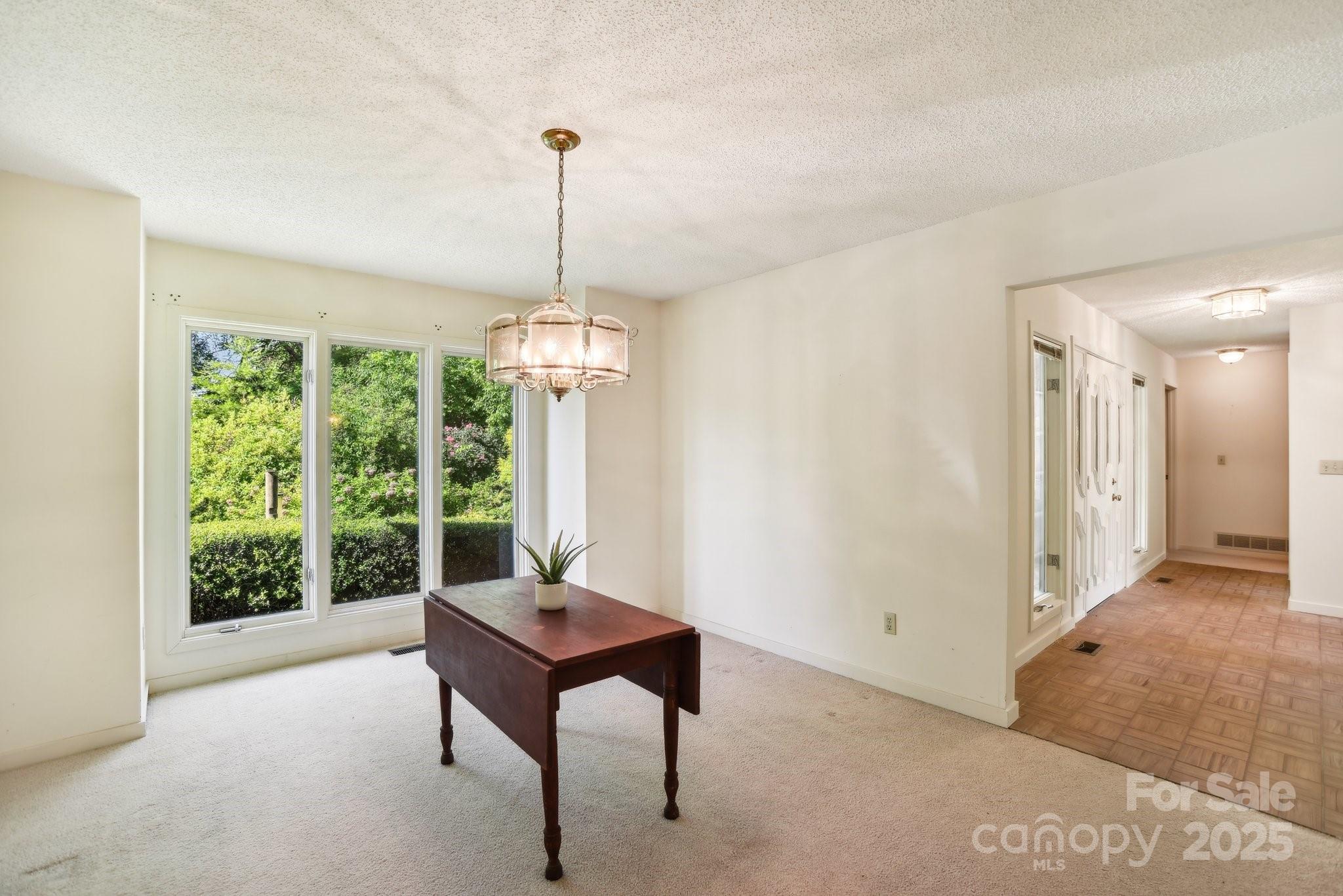 2281 Bearwallow Road Hendersonville, NC 28792 - Photo 14 of 46 a living room with furniture and a window