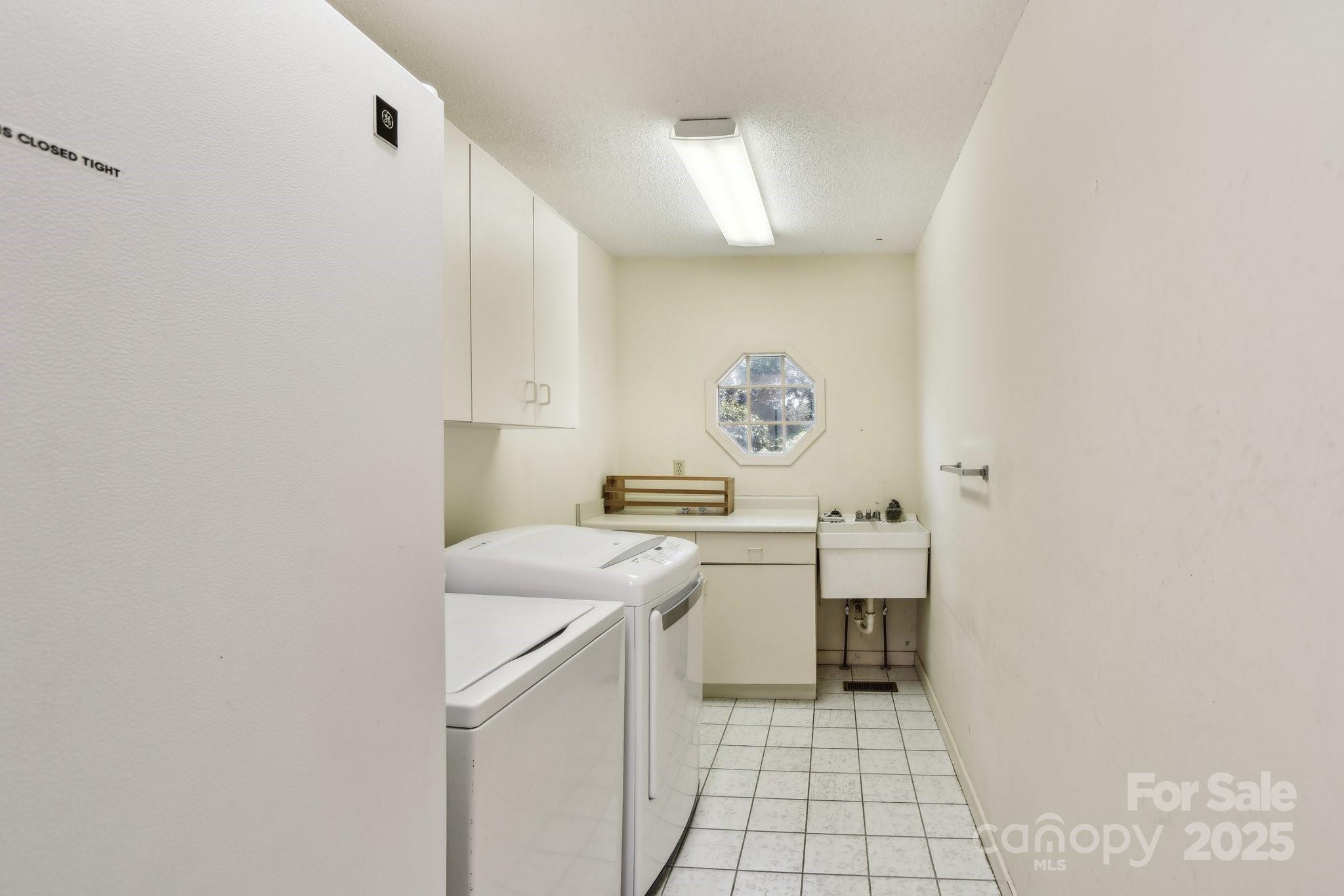2281 Bearwallow Road Hendersonville, NC 28792 - Photo 24 of 46 a kitchen with a sink cabinets and a stove top oven