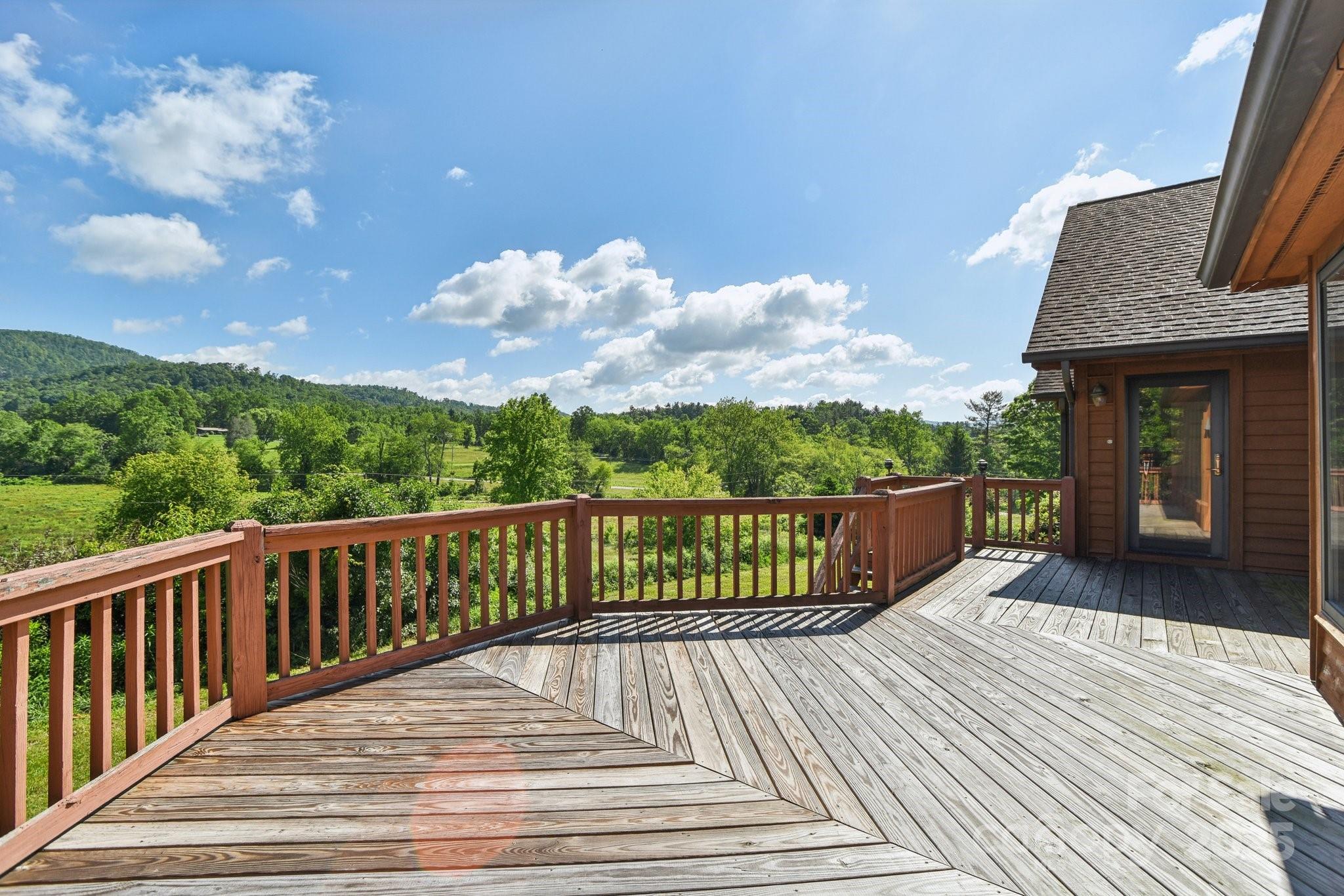 2281 Bearwallow Road Hendersonville, NC 28792 - Photo 30 of 46 a balcony with wooden floor and city view