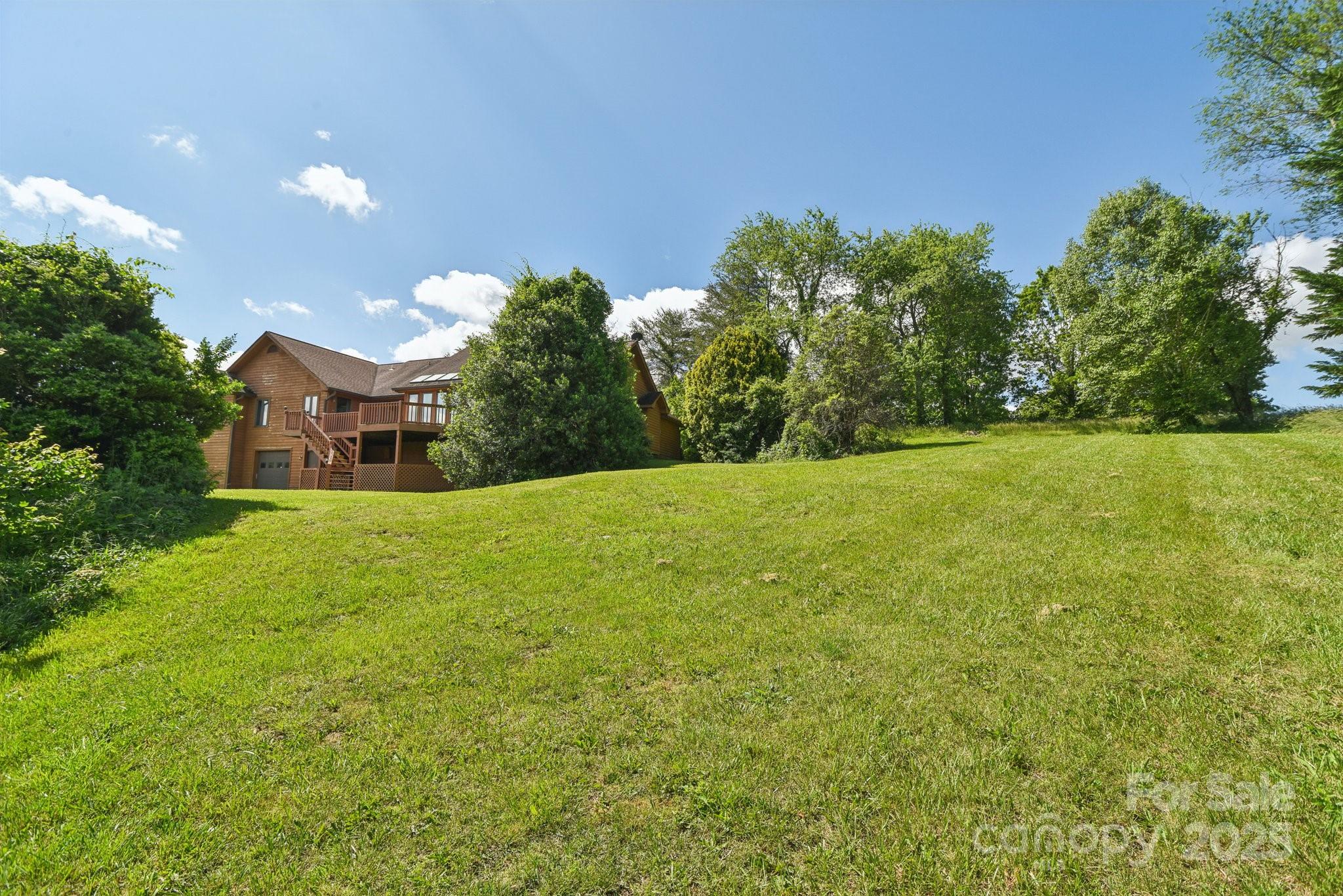 2281 Bearwallow Road Hendersonville, NC 28792 - Photo 31 of 46 a front view of a house with a yard