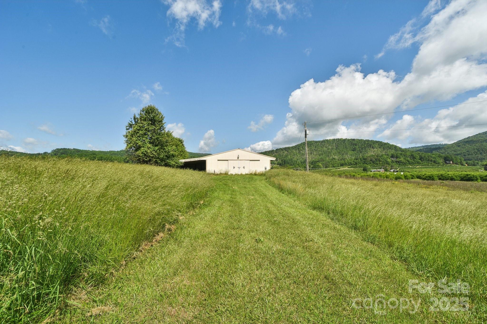 2281 Bearwallow Road Hendersonville, NC 28792 - Photo 32 of 46 a swimming pool with an outdoor space and seating