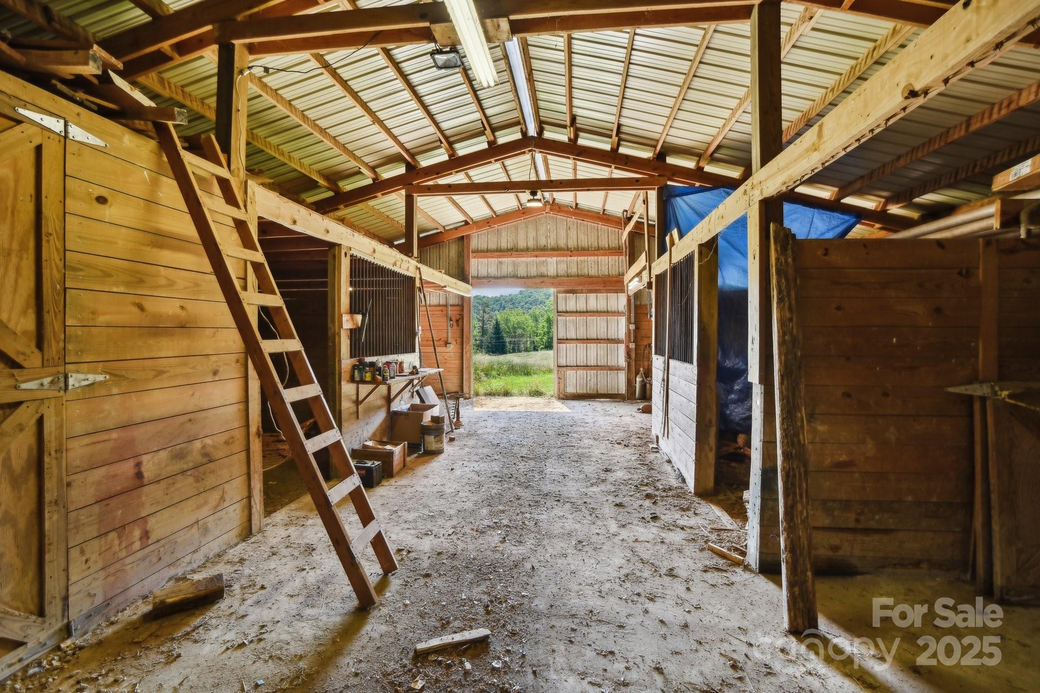 2281 Bearwallow Road Hendersonville, NC 28792 - Photo 35 of 46 a view of a room with wooden stairs