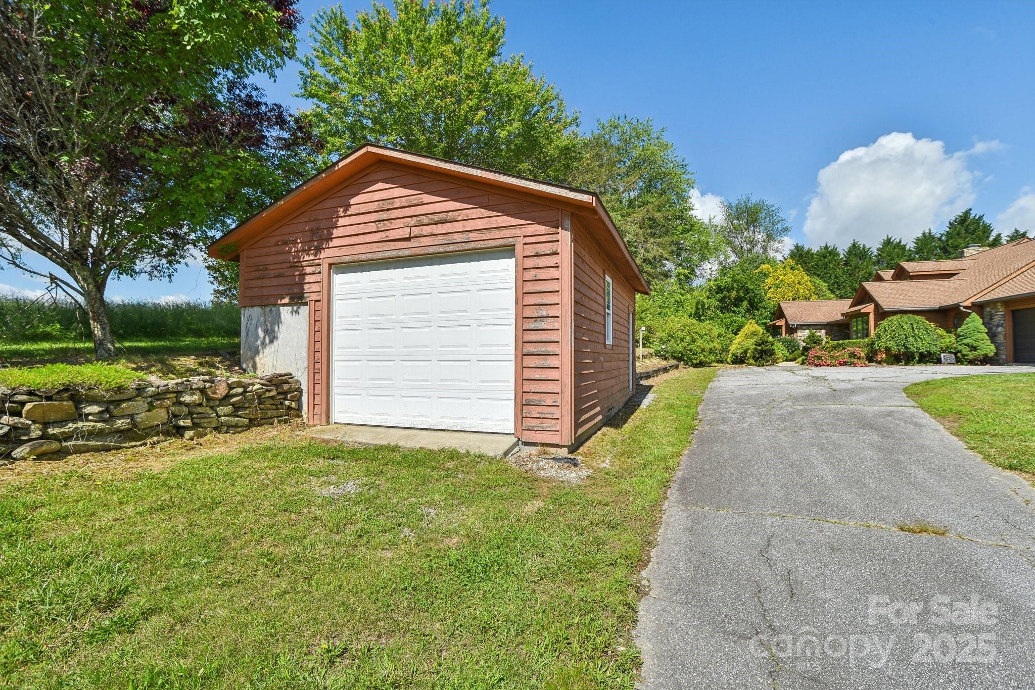 2281 Bearwallow Road Hendersonville, NC 28792 - Photo 36 of 46 a view of a house with a yard