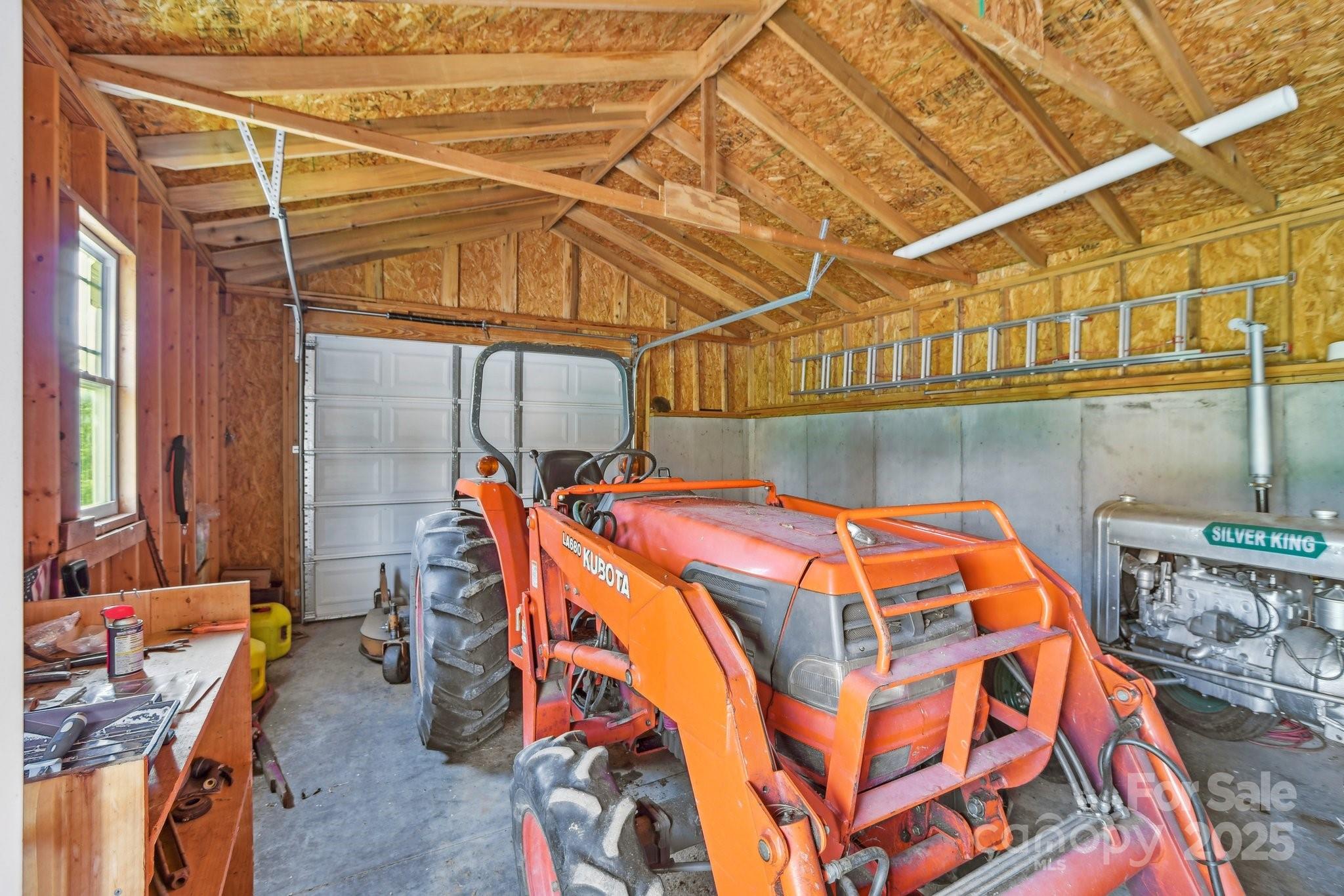 2281 Bearwallow Road Hendersonville, NC 28792 - Photo 37 of 46 a bed room with a bed and a walk in closet