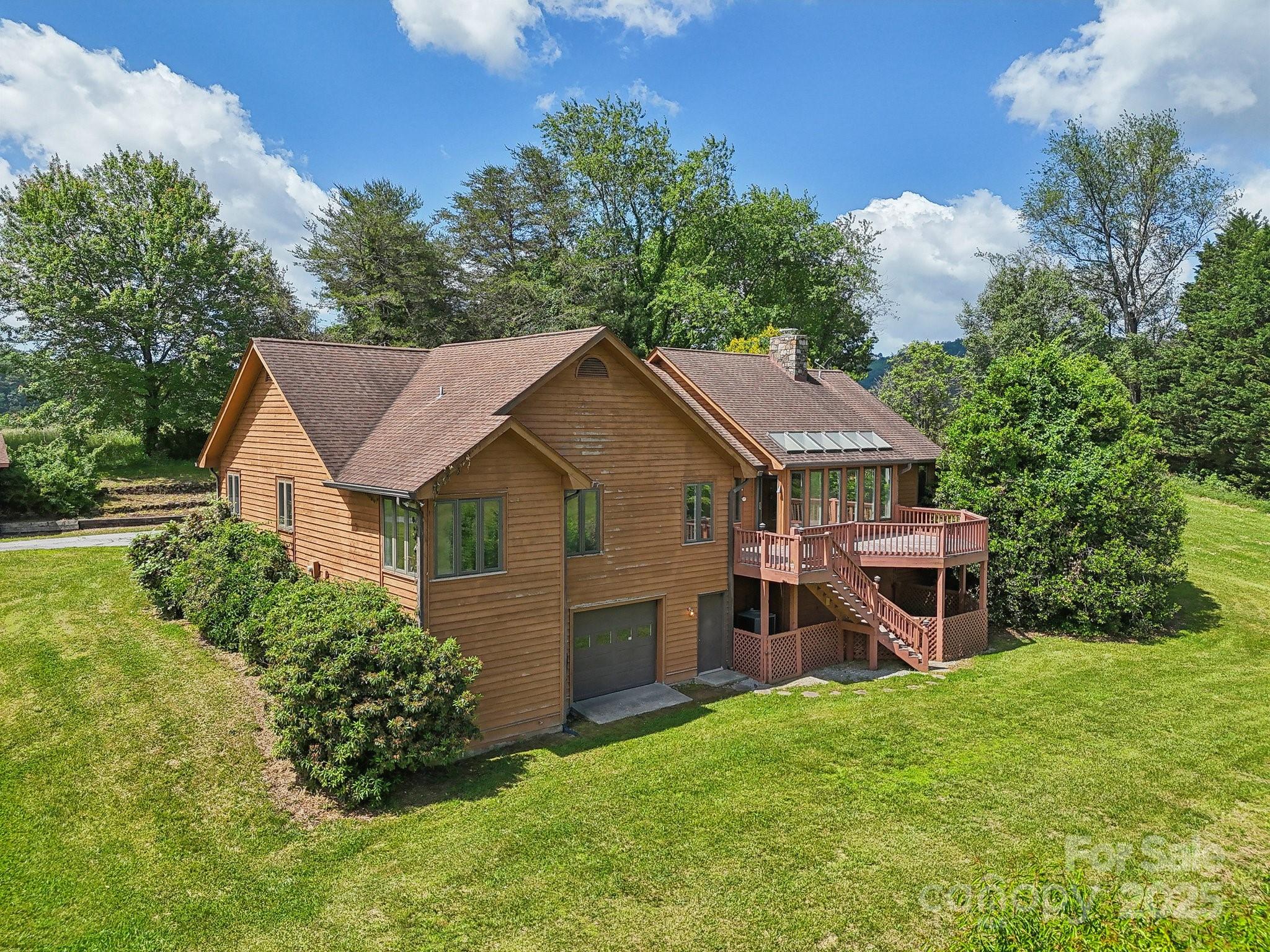 2281 Bearwallow Road Hendersonville, NC 28792 - Photo 40 of 46 front view of a house with a yard