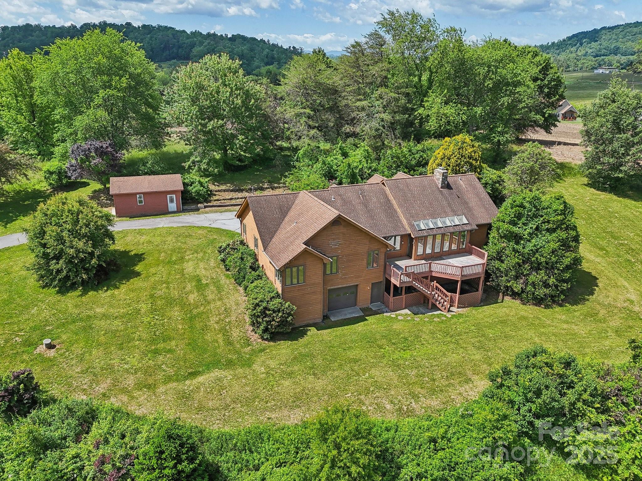 2281 Bearwallow Road Hendersonville, NC 28792 - Photo 42 of 46 an aerial view of a house with swimming pool garden and patio