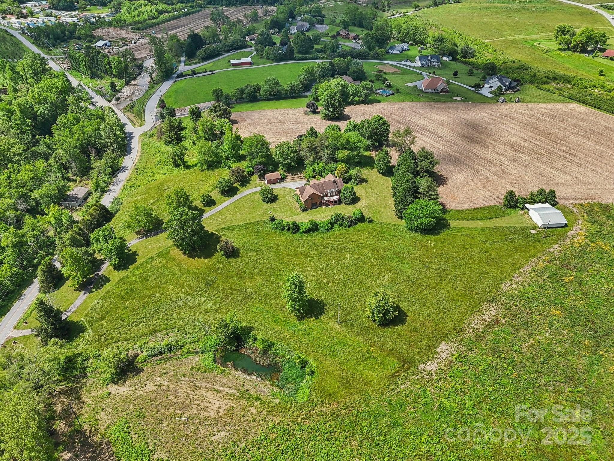 2281 Bearwallow Road Hendersonville, NC 28792 - Photo 43 of 46 an aerial view of a garden with houses