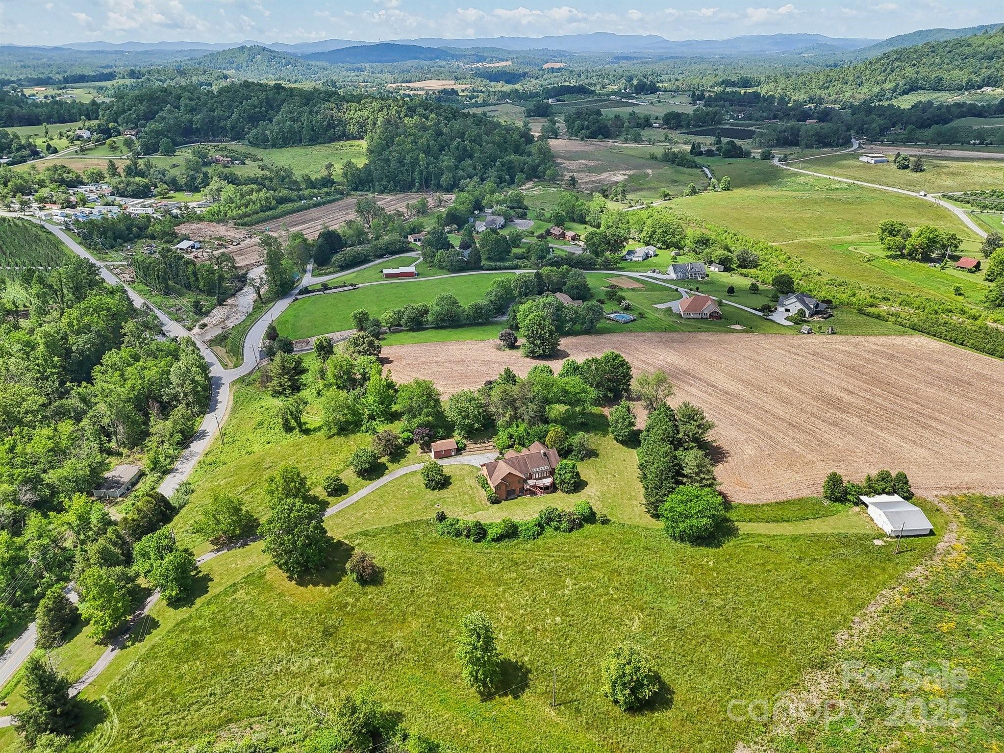 2281 Bearwallow Road Hendersonville, NC 28792 - Photo 44 of 46 a view of a water pond with green field