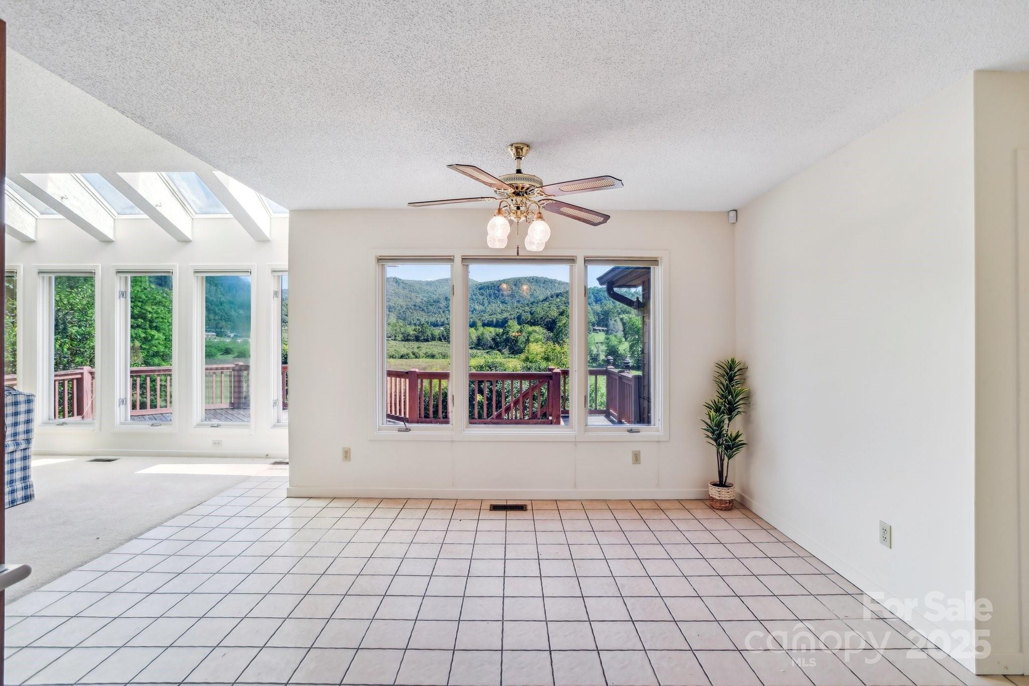 2281 Bearwallow Road Hendersonville, NC 28792 - Photo 8 of 46 a view of an empty room with a window