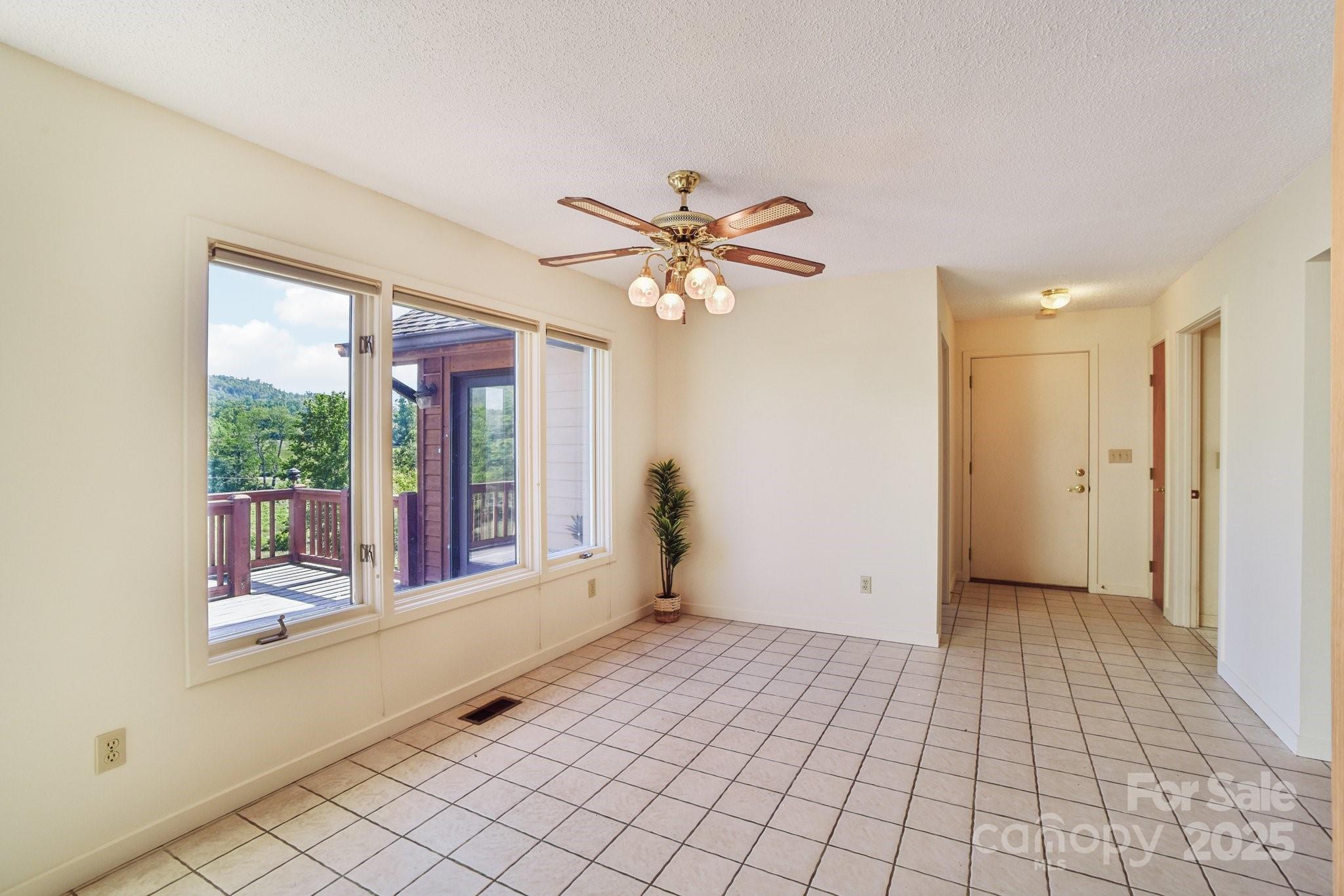 2281 Bearwallow Road Hendersonville, NC 28792 - Photo 9 of 46 a view of an empty room with window
