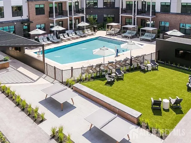 a view of a swimming pool with chairs