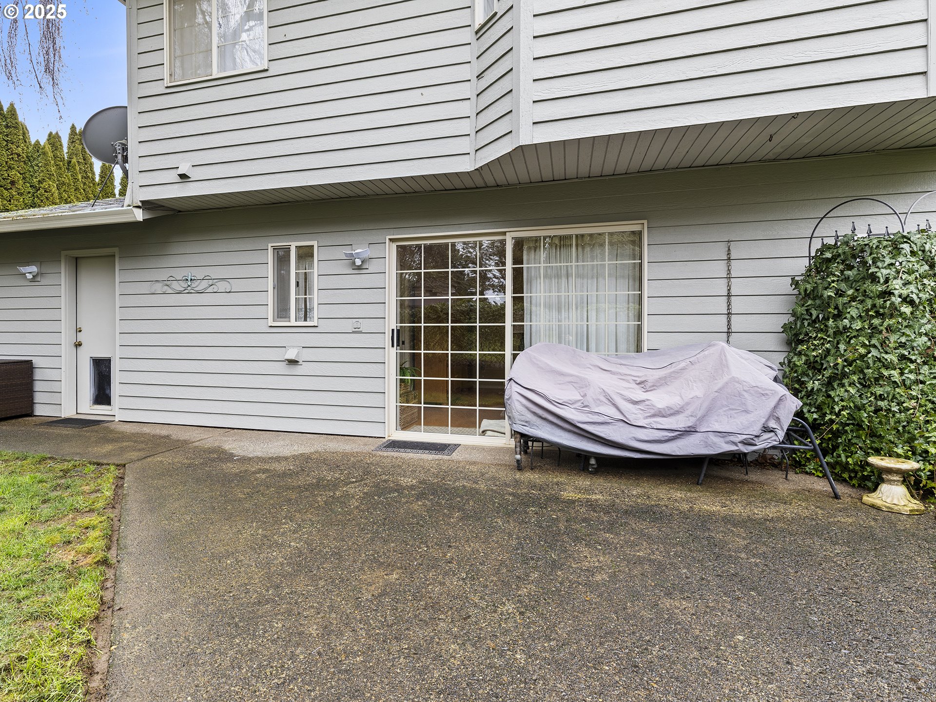 5906 Northwest 169th Street Ridgefield, WA 98642 - Photo 27 of 35 a view of a white house with a sink and a potted plant