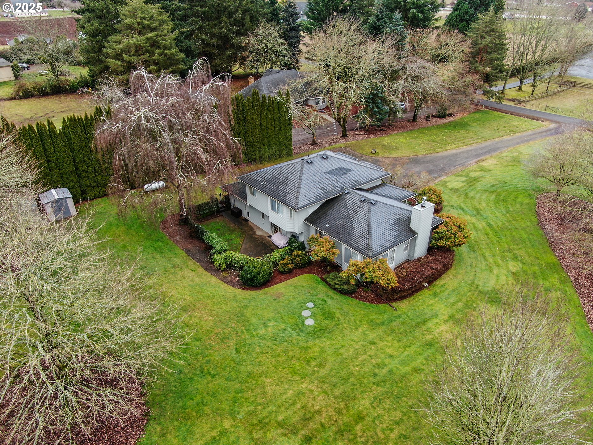 5906 Northwest 169th Street Ridgefield, WA 98642 - Photo 34 of 35 a view of a garden with large trees