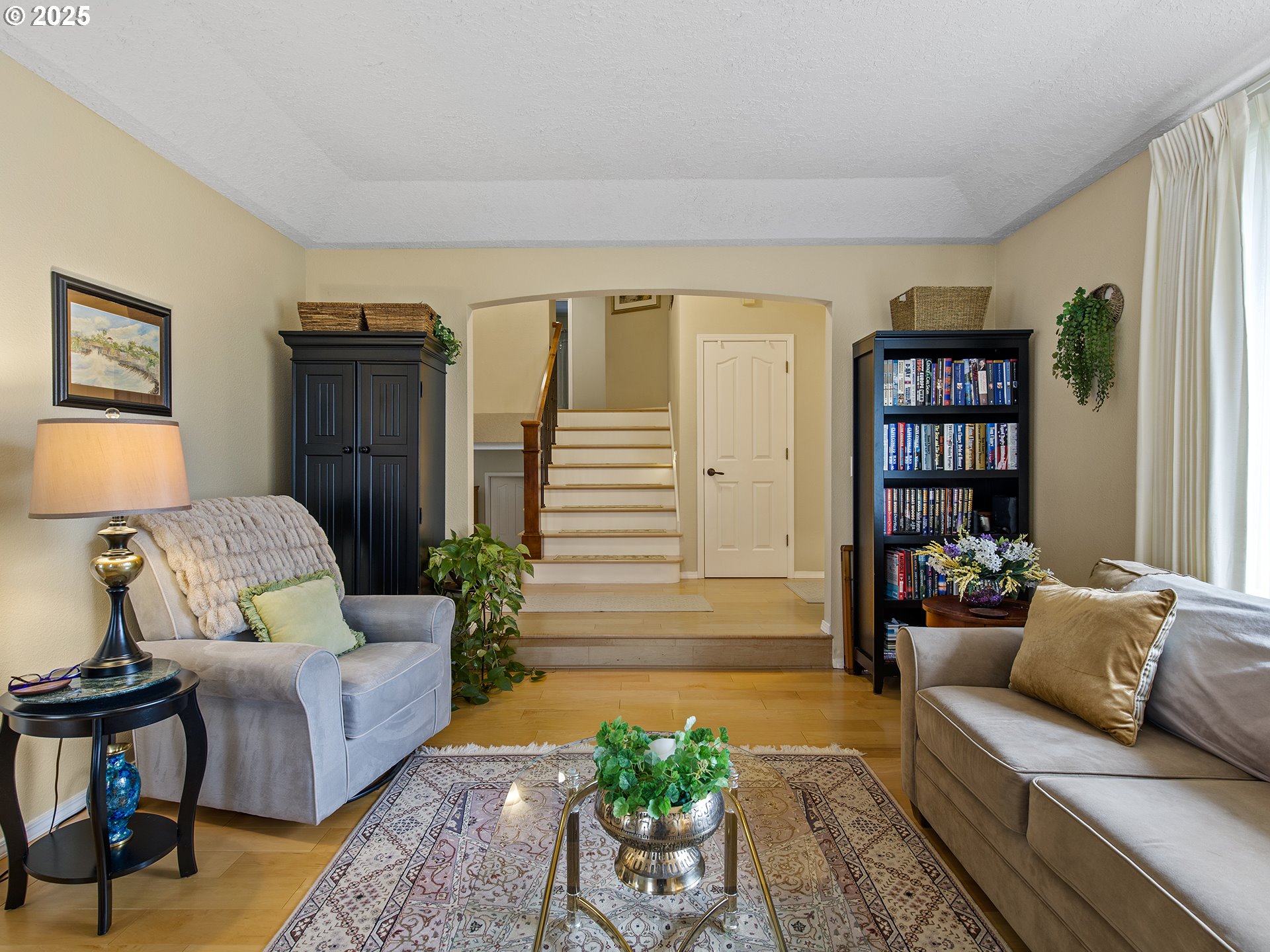 5906 Northwest 169th Street Ridgefield, WA 98642 - Photo 7 of 35 a living room with furniture and painting on the wall