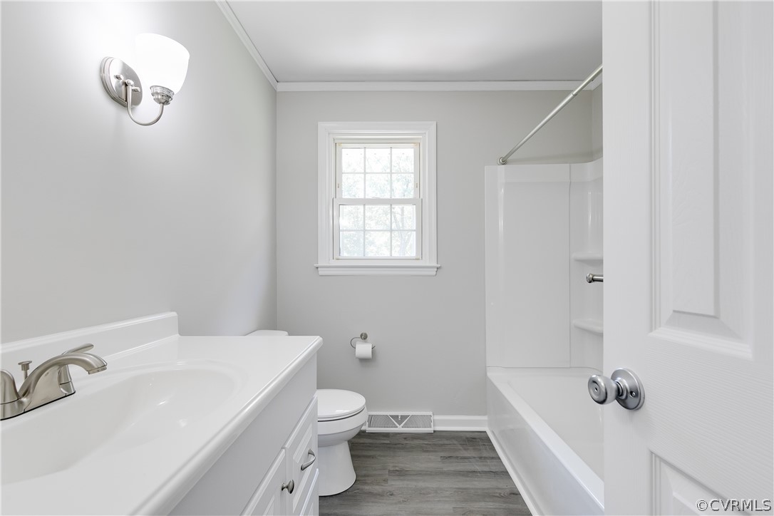14911 Rowlett Road Chesterfield, VA 23838 - Photo 11 of 50 a bathroom with a sink a toilet and shower
