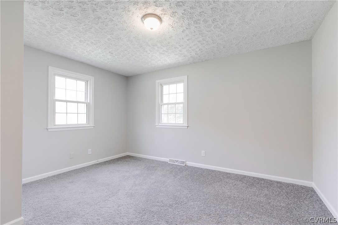 14911 Rowlett Road Chesterfield, VA 23838 - Photo 13 of 50 an empty room with windows