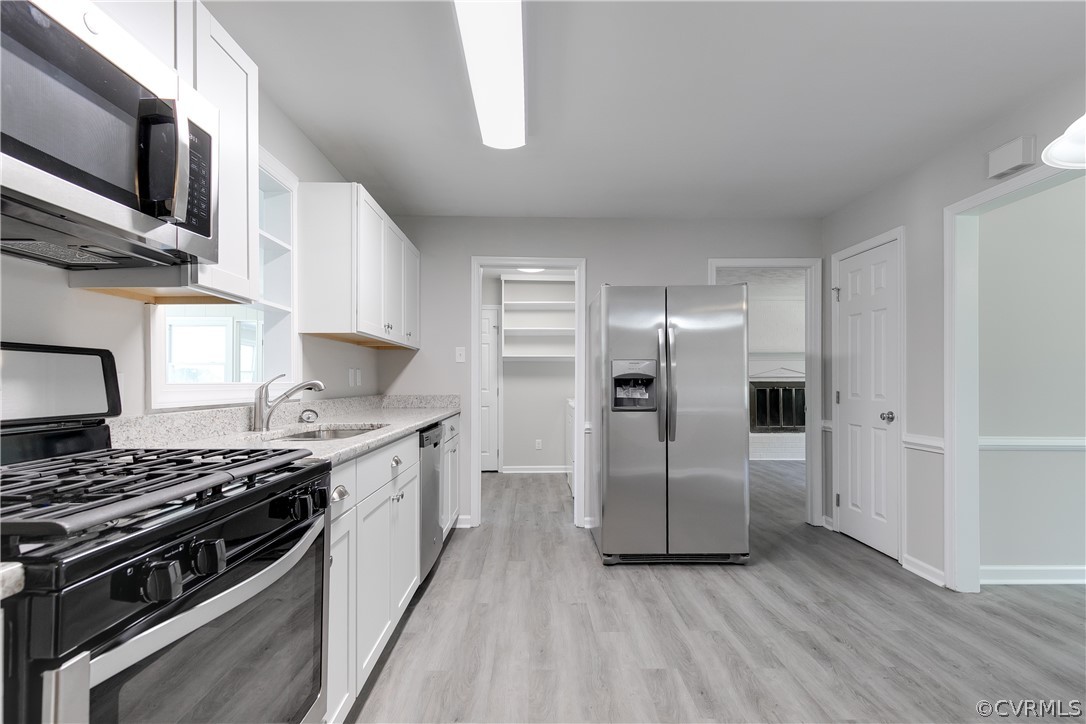 14911 Rowlett Road Chesterfield, VA 23838 - Photo 18 of 50 a kitchen with stainless steel appliances a stove and a refrigerator