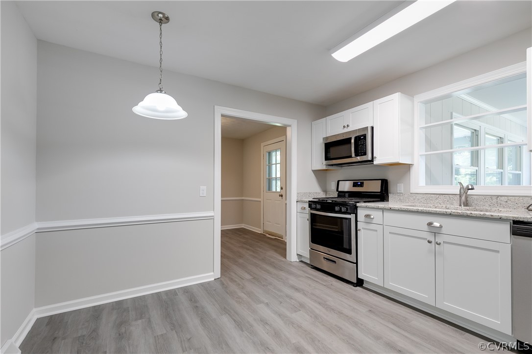 14911 Rowlett Road Chesterfield, VA 23838 - Photo 22 of 50 a kitchen with a sink stainless steel appliances and cabinets