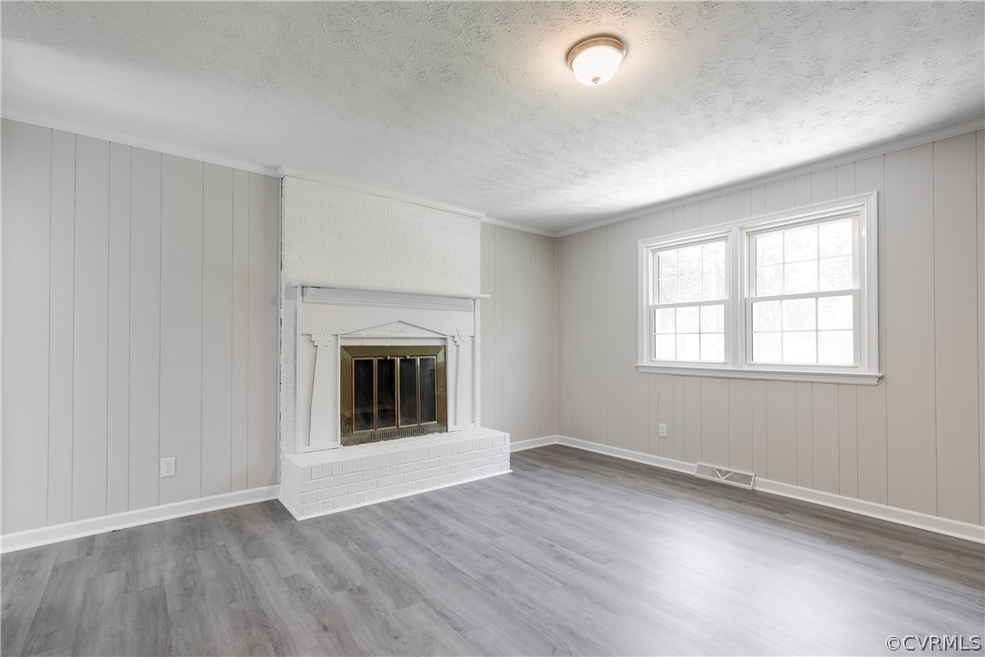 14911 Rowlett Road Chesterfield, VA 23838 - Photo 23 of 50 an empty room with wooden floor and windows