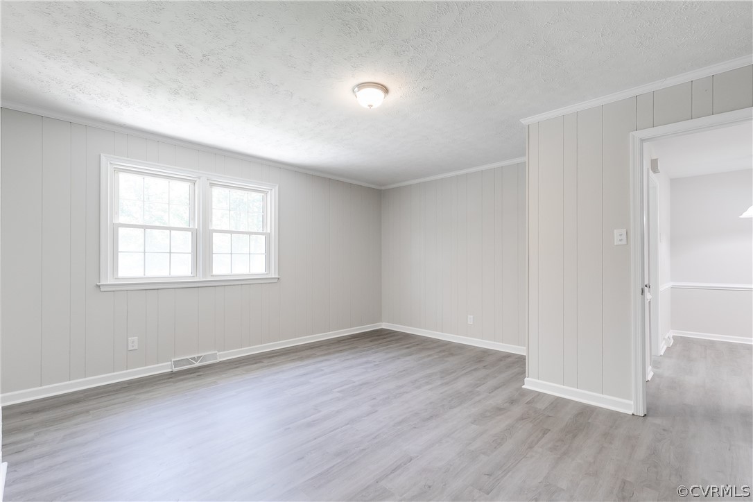 14911 Rowlett Road Chesterfield, VA 23838 - Photo 25 of 50 an empty room with wooden floor and windows