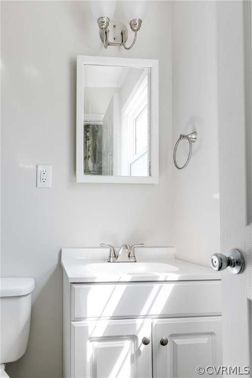 14911 Rowlett Road Chesterfield, VA 23838 - Photo 27 of 50 a bathroom with a toilet sink and mirror