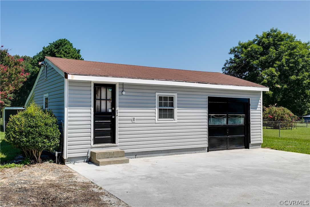 14911 Rowlett Road Chesterfield, VA 23838 - Photo 38 of 50 a front view of a house with a yard and garage