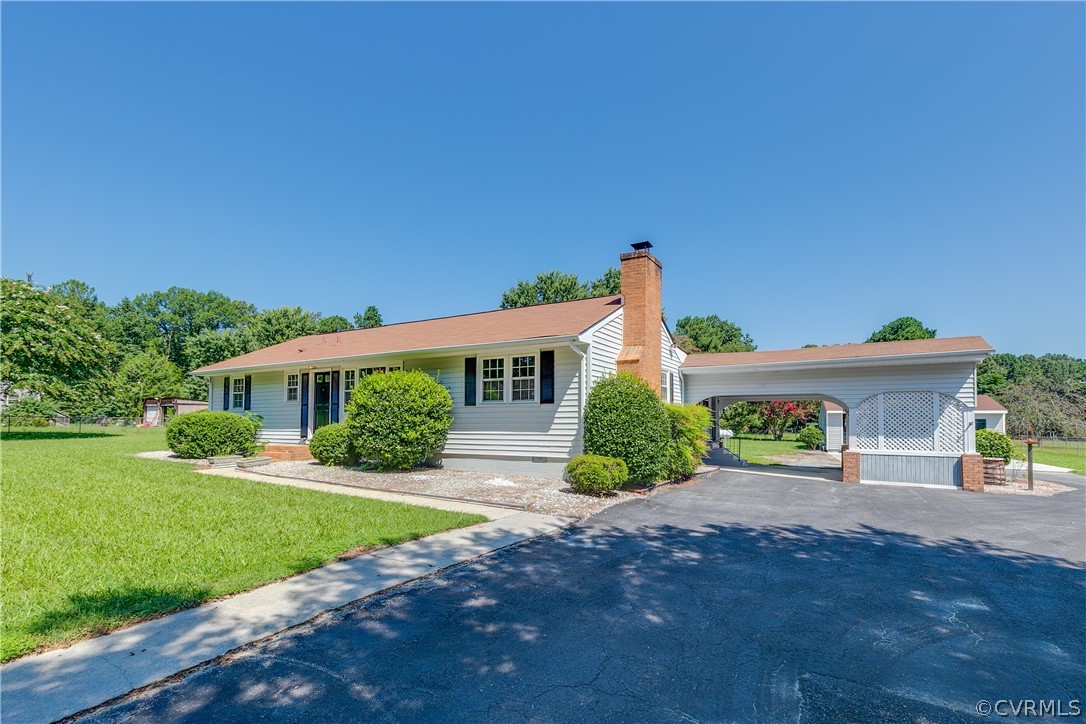 14911 Rowlett Road Chesterfield, VA 23838 - Photo 5 of 50 front view of a house with a yard