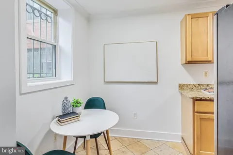 a view of a kitchen area with furniture and a window