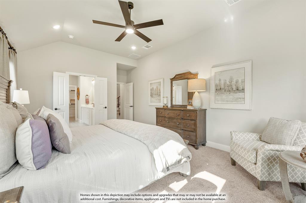 200 Roughrider Trail Josephine, TX 75173 - Photo 20 of 39 a spacious bedroom with a bed a couch and a chandelier
