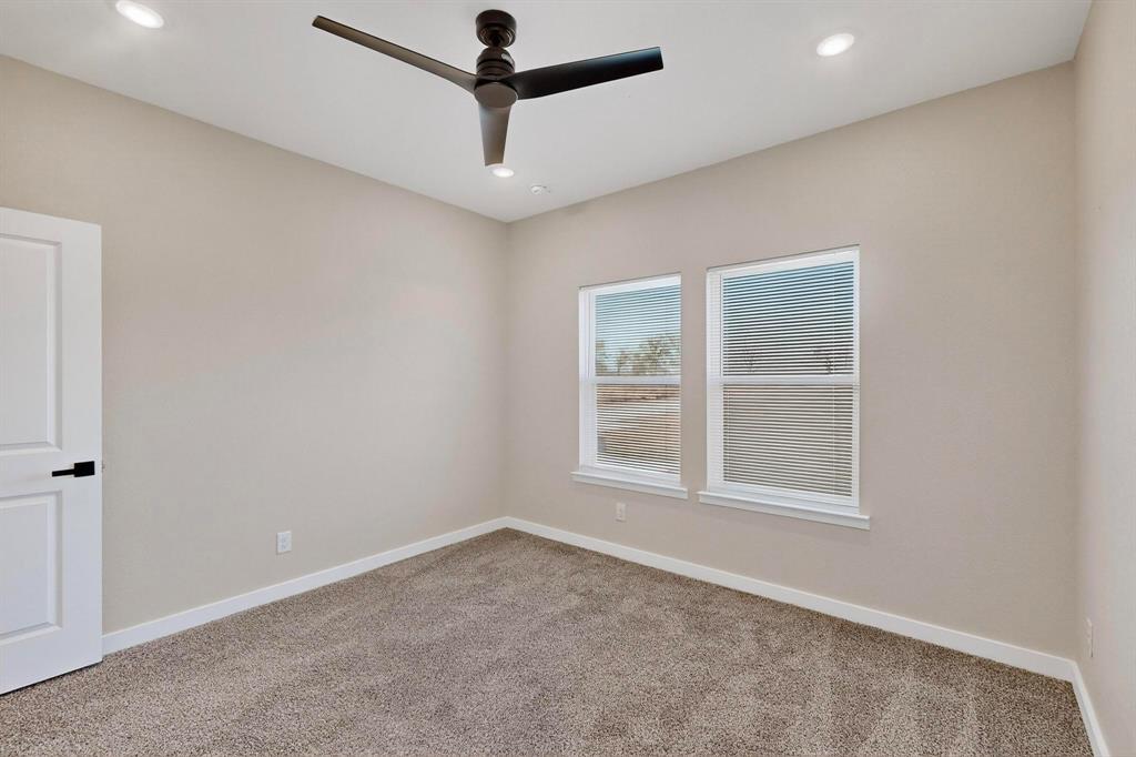 740 Section House Road Ennis, TX 75119 - Photo 27 of 37 an empty room with a window