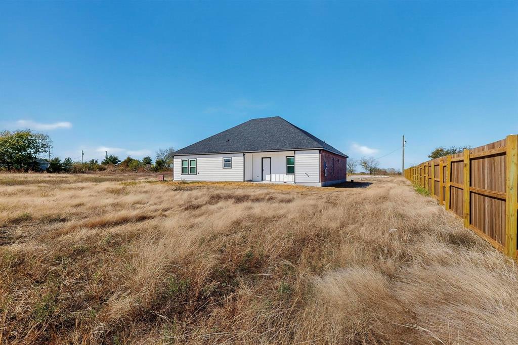 740 Section House Road Ennis, TX 75119 - Photo 35 of 37 a house with yard