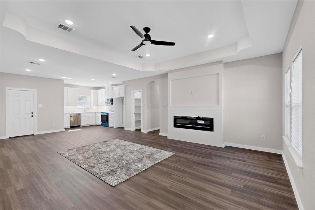 740 Section House Road Ennis, TX 75119 - Photo 8 of 37 a view of empty room with wooden floor and ceiling fan
