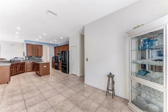 a kitchen with stainless steel appliances granite countertop a stove and a sink