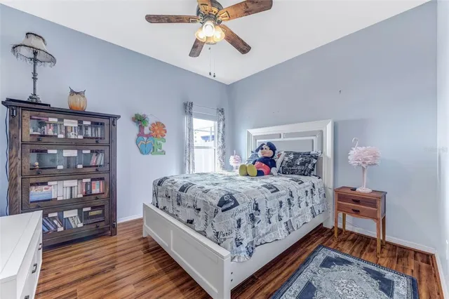 a bedroom with a bed and dresser