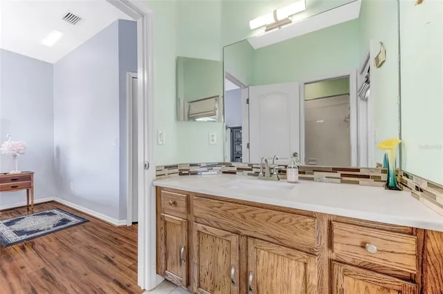 a bathroom with a sink and a mirror