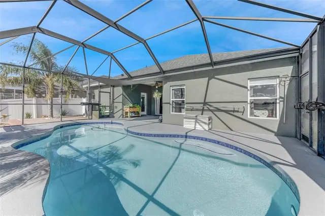 a view of a swimming pool with a patio