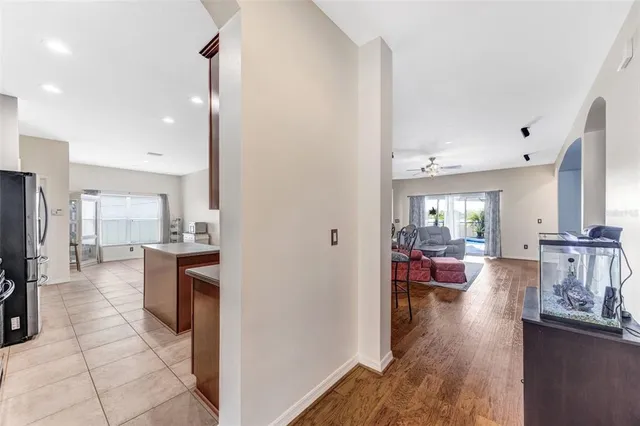 a view of a living room kitchen and a wooden floor
